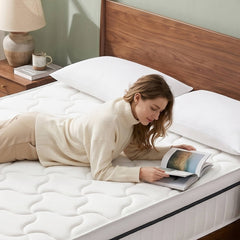 Woman reading on ABLYEA Air Hybrid Mattress with pressure relief and comfortable body support