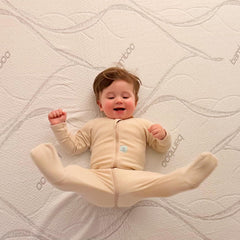 Baby playing happily on ABLYEA Kids Tencel Mattress with soft comfort for growing little ones